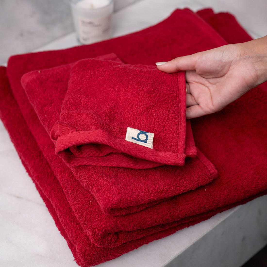 Dark red 100% cotton towel folded
