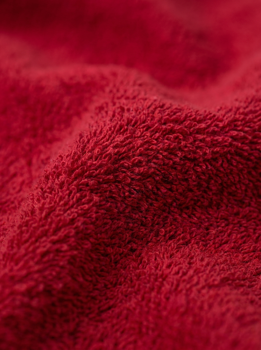 Red cotton towel texture close-up