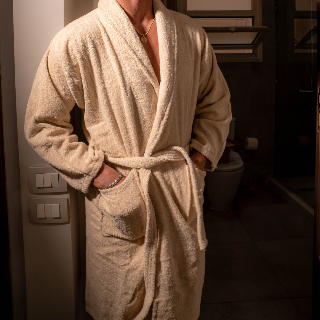 Woman wearing rose 100% cotton bathrobe