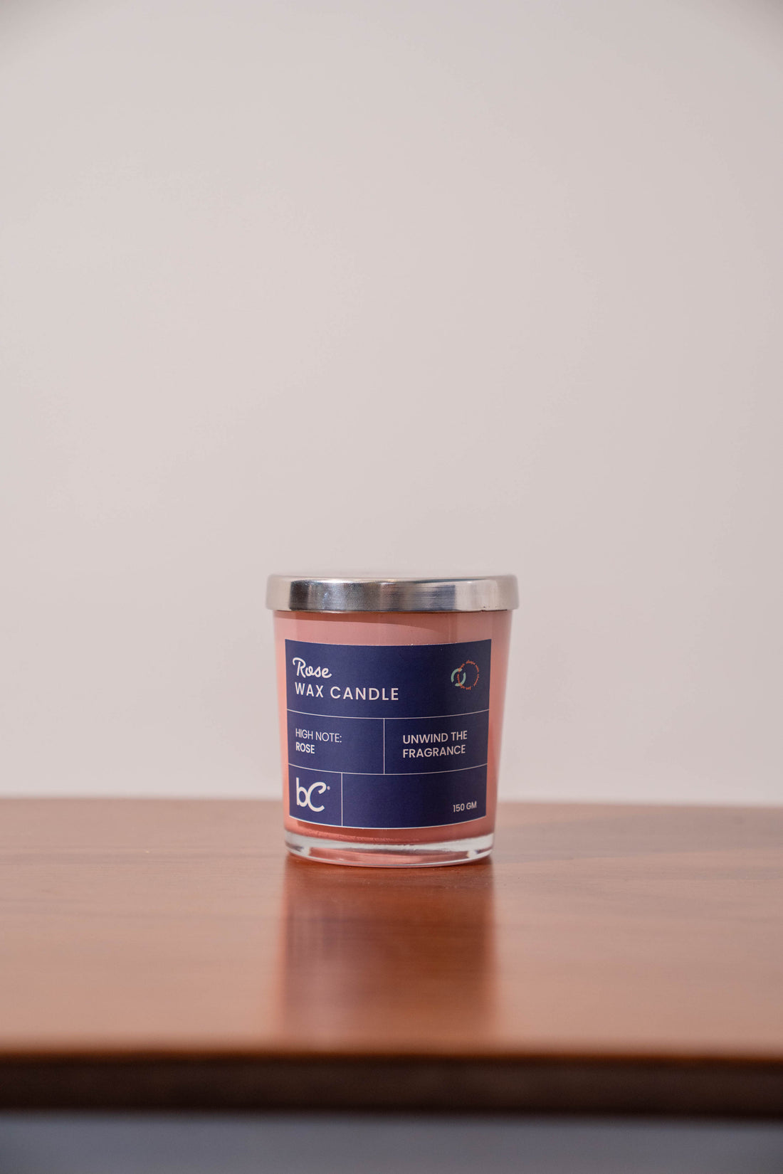 Scented candle styled in bedroom setting