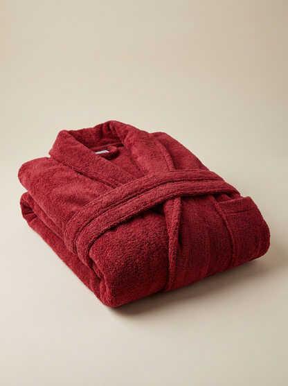 Red cotton bathrobe folded