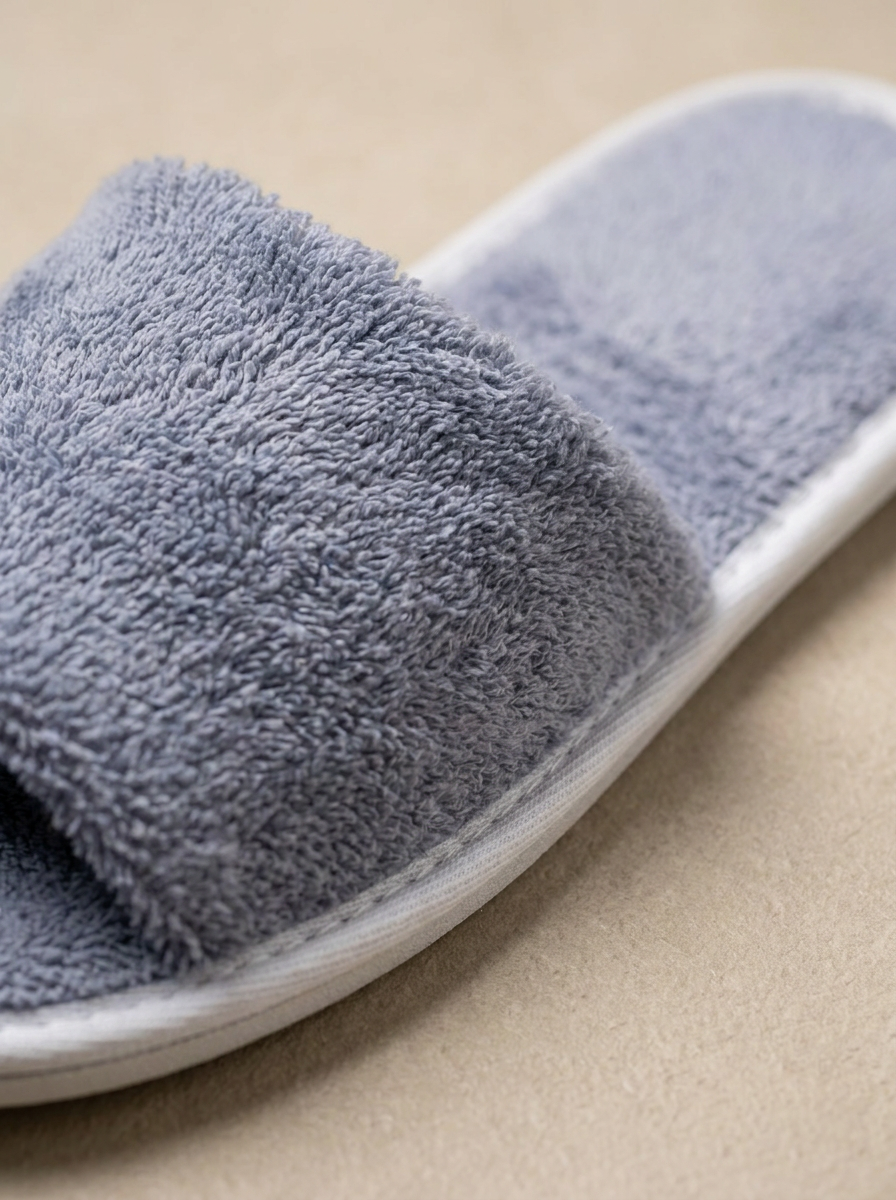 Grey cotton slipper texture close-up