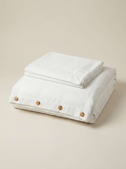 White microfiber duvet cover folded with buttons