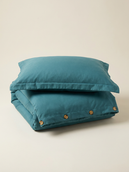 Teal microfiber duvet cover folded with buttons