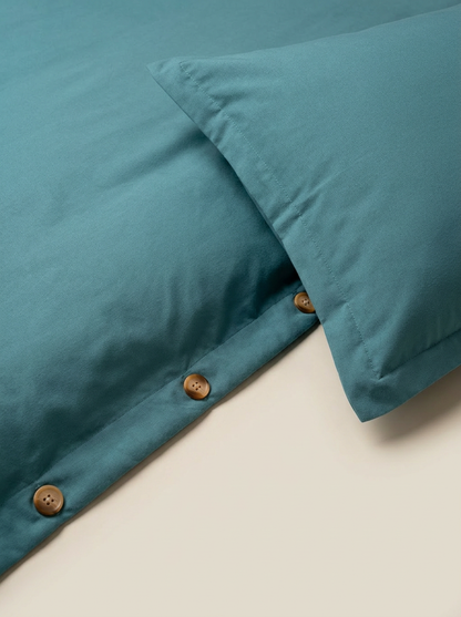 Teal duvet cover button closure close-up