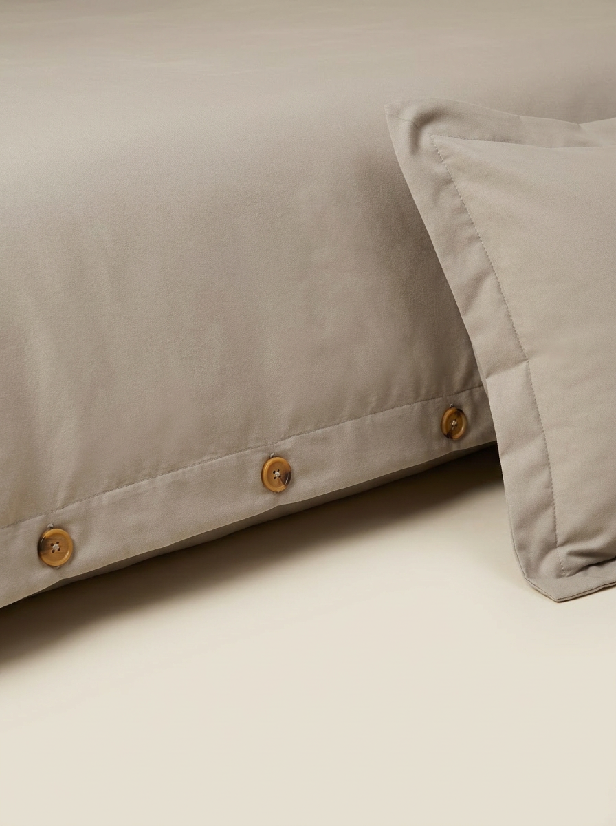 Greige duvet cover button closure close-up